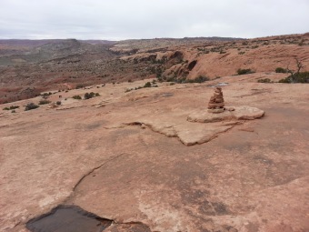 This picture was taken on the Delicate Arch hike.  I'm glad we didn't know what to expect going into that one.  Basically it was a mile of steep incline up and then a mile of steep incline down.  Honestly though, it was nothing compared to our CO hikes.  This picture shows a cairn (pile of rocks) that shows you where to go.  It also shows how far we had climbed.  That flat area down there?  Yeah, that is where we started...